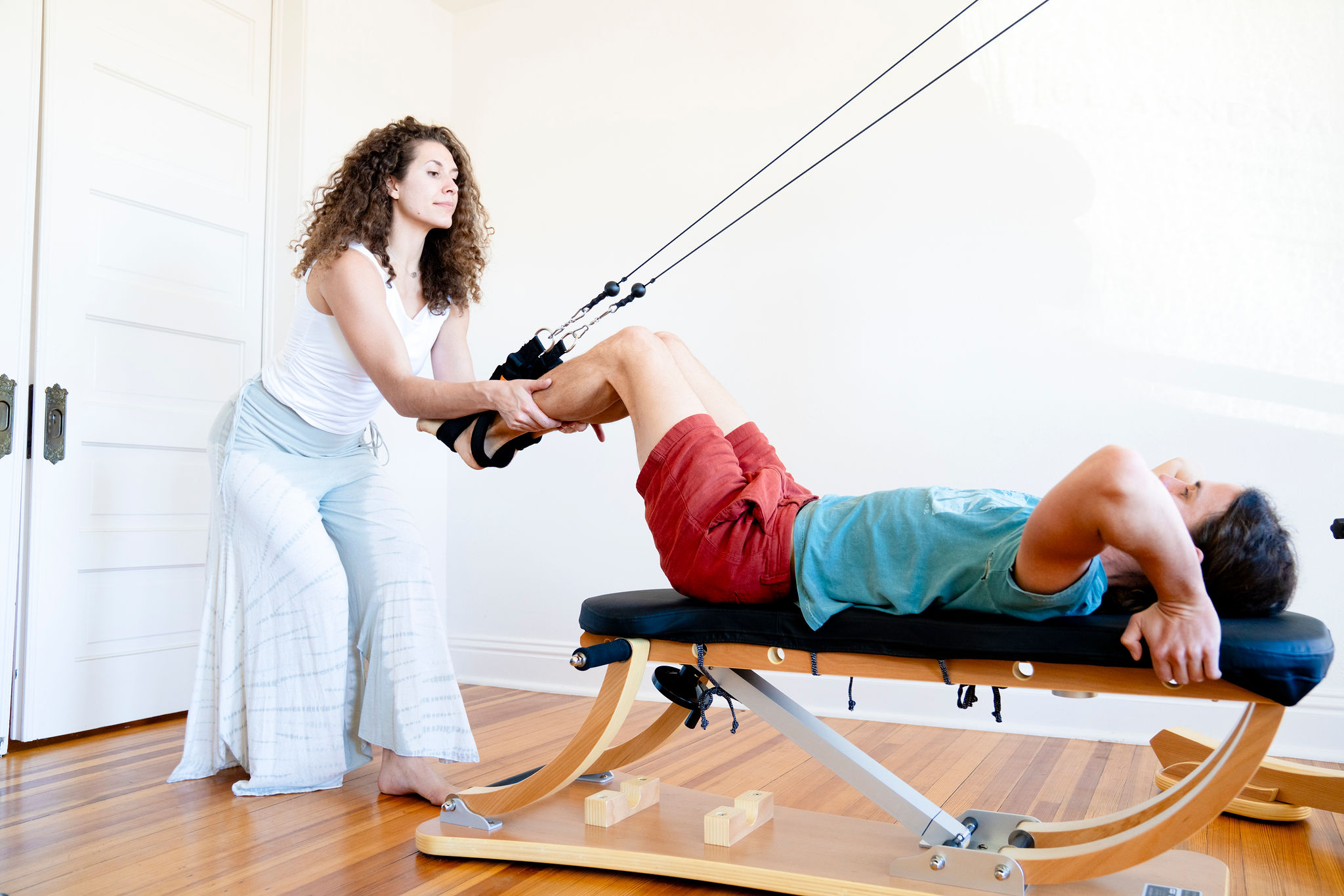 Hands-on Guidance during hamstring strengthening exercise.