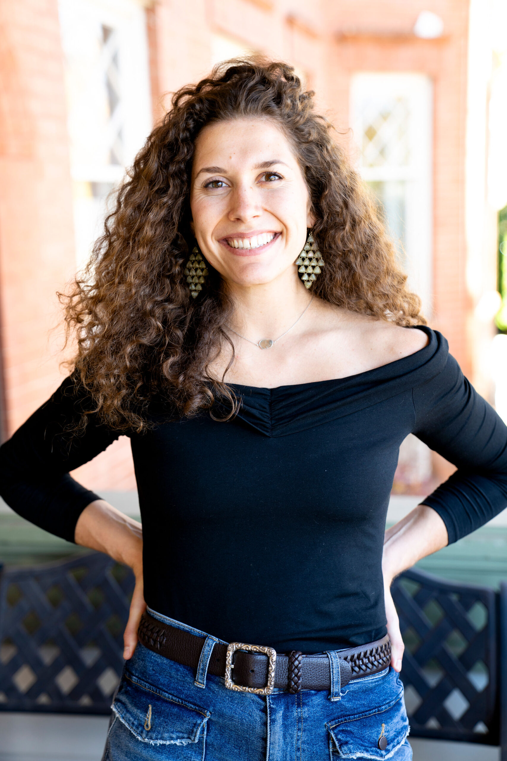 Julianne Nagy standing in front of her Boulder Studio.